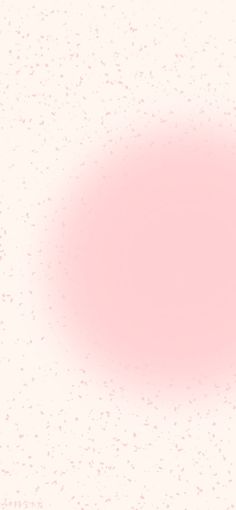 a pink circle on a white background with speckles in the bottom right corner