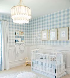 a baby's room with blue and white checkered walls