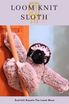 a stuffed animal hanging on the side of a door with text that reads, loom knit sloth