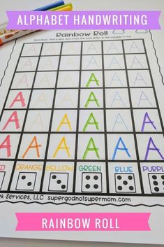 an alphabet handwriting practice sheet with the letters and numbers in rainbow roll on top of it