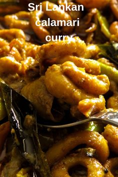 a close up of food on a plate with a fork and spoon next to it