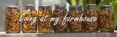 several jars filled with nuts sitting on top of a table