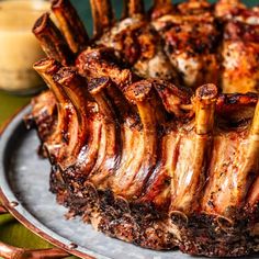 the meat is sliced and ready to be served on the plate with sauce in the background