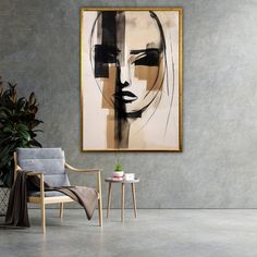 a painting hanging on the wall next to a chair and table with a potted plant