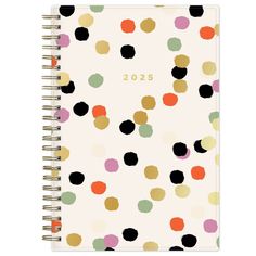 a spiral notebook with colorful dots on it