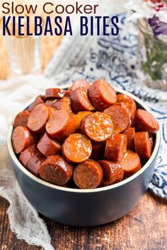 slow cooker kielbasa bites in a bowl on a wooden table with text overlay