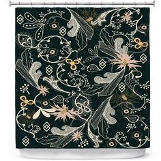 a black shower curtain with white and gold flowers on the bottom, in front of a dark background