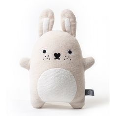 a white stuffed animal with black eyes and ears