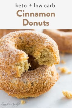 a close up of a doughnut with the words keto and low carb cinnamon donuts