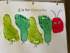 three handprints of caterpillar and crayon on a piece of paper