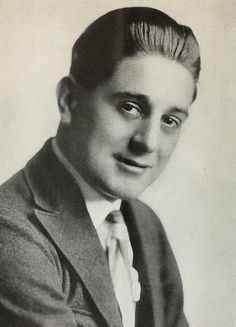 an old black and white photo of a man in a suit