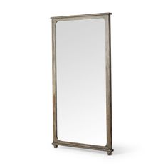 a tall mirror sitting on top of a white floor