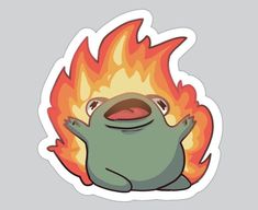 a sticker with a cartoon character on it's face and fire in the background