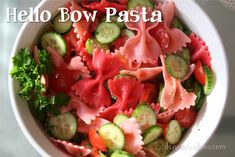 a white bowl filled with lots of different types of food on top of a table