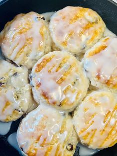 a pan filled with biscuits covered in icing