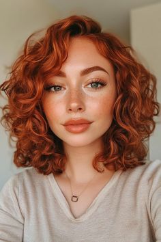 Click for More ➡️ | Save for Later ❤️  A curly lob that showcases natural curls with auburn highlights, adding warmth and dimension. Perfect for black women and over 40. (Curly Lob with Auburn Highlights - Short Hairstyles For Women) Short Curly Hairstyles With Highlights, Red Hair Short Curly, Elegant Haircuts For Women, Naturally Curly Auburn Hair, Copper Short Curly Hair, Red Curly Hairstyles, Hairstyles For Women Easy