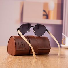 The personalized wooden sunglasses and leather sunglasses boxes are perfect wedding gift idea for your Groom, Groomsmen, Best Man, Dad, Father of the bride, Father of the groom, it's also a good choice for birthday, graduation, wedding party, holiday, anniversary, valentines day, Christmas gift or any other occasion. ♥Sunglasses Details: These sunglasses are UV400 standard. The arms of the sunglasses are made from natural wood. Every pair is completely unique to you. Lens width is 60mm. Temple L Groomsmen Gifts Ideas, Personalized Sunglasses, Bachelor Gifts, Sunglasses Box, Bachelor Party Gifts, Best Man Gift, Wedding Party Gifts, Groom Groomsmen, Wooden Sunglasses