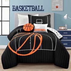 a bed room with a basketball comforter and pillows