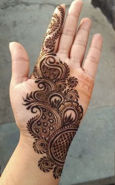 a hand that has a henna on it