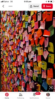 a wall covered in lots of colorful sticky notes