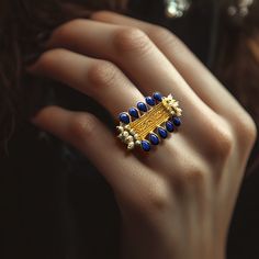 This a Ring made of brass base - gold dipped-Lapis Lazuli and mother of pearl stones. All products were created with love and expertise, resulting in exquisite pieces that capture the essence of enduring elegance. Do not apply perfume, hairspray, or deodorant before wearing your jewelry as certain chemicals may damage the finish. Always remove your jewelry before swimming, bathing, doing household chores, or using abrasive cleaners. Use a soft dry cloth to gently polish your plated jewelry. Regal Elegance, Dangler Earrings, Warrior Queen, Frame Blue, Blue Lapis Lazuli, White Lilies, Blue Lapis, Household Chores, Gold Dipped