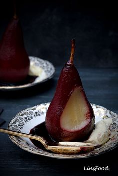 two plates with pears and ice cream on them