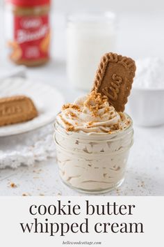 cookie butter whipped cream in a small glass jar with graham crackers on the side