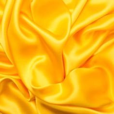 an image of a yellow cloth textured with satine or polyesterine fabric