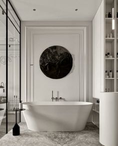 a white bathtub sitting next to a toilet in a bathroom under a circular mirror