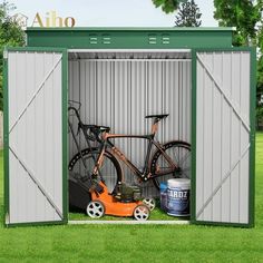 an outdoor storage shed with two bikes in it