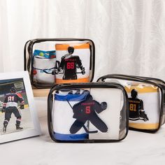 three bags with hockey jerseys on them are sitting next to an image of a player