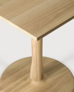 a close up of a wooden table on a white background