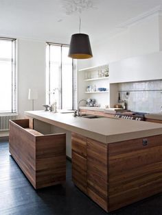 an island in the middle of a kitchen