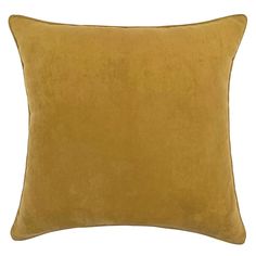 a yellow velvet pillow on a white background