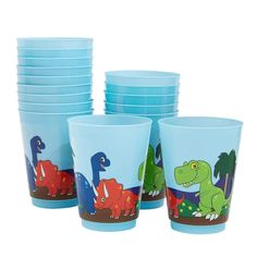 a set of blue cups with dinosaurs painted on the front and sides, all stacked together