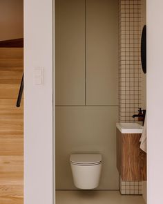 a bathroom with a toilet and sink in it