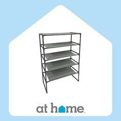 a metal shelf with three shelves and the words at home above it on a blue background