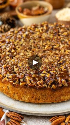 a cake with pecans and nuts on top