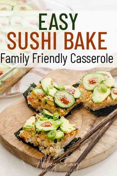 sushi bake on a wooden board with chopsticks and cucumbers