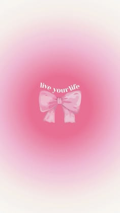 a pink bow with the words live, your life on it's side in white lettering