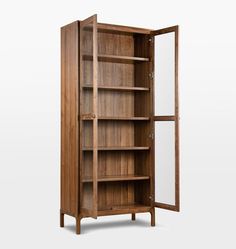 an open wooden bookcase with glass doors