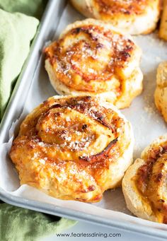 several small pastries on a baking sheet