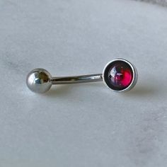 "Garnet Belly Button Ring/316L Surgical Steel/Hypoallergenic/14 Gauge Body Jewelry/Gift for Her/January Birthday Present/Piercing ** Ships out in 1-2 business days! ** ~ These Hypoallergenic bellybutton rings feature a beautiful Natural Garnet Cabochon. ~ Perfect for sensitive skin, making a great gift choice for the \"hard to buy for\" or even a gift for YOURSELF! 💕 M A T E R I A L S: - Genuine Garnet Cabochons - 316L Surgical Steel HYPOALLERGENIC!! DIMENSIONS: - Bar 14 gauge & 12mm in Len Punk Belly Button Piercing, Belly Button Piercing Grunge, Silver Belly Button Piercing, Unique Belly Rings, Bellybutton Rings, Bellybutton Piercings, Belly Button Piercing Jewelry, Belly Piercing Jewelry, Belly Button Jewelry