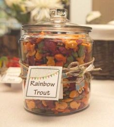 a glass jar filled with lots of colorful candy