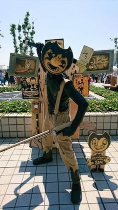 a man dressed in costume standing next to a fire hydrant with signs on it