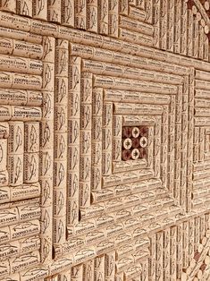 an intricately carved wooden wall with many words on it