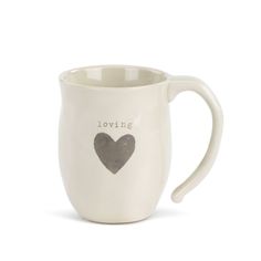 a white coffee mug with a black heart on the front and i love you written on the side