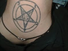 a person with a tattoo on their neck has a pentagramil in the middle