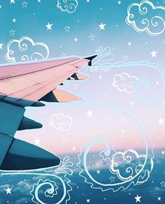 an airplane wing with clouds and stars in the sky