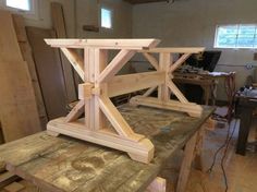 a table made out of wooden planks in a room